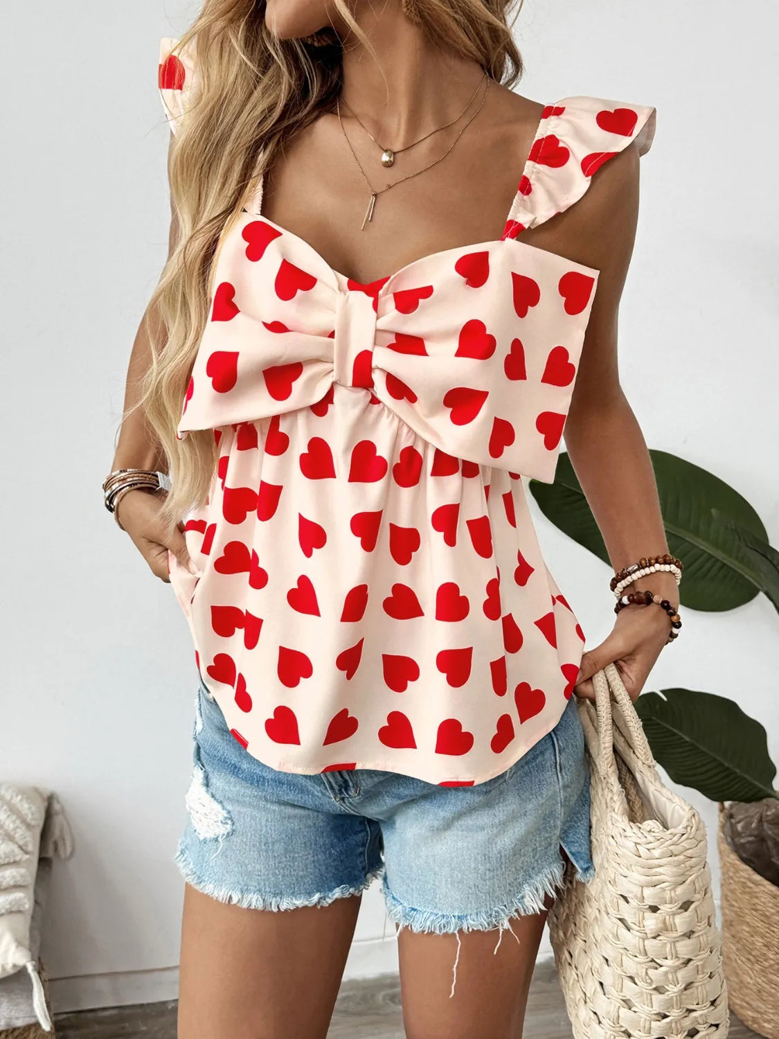 Peplum-Bluse mit Herzprint und Schleife vorne