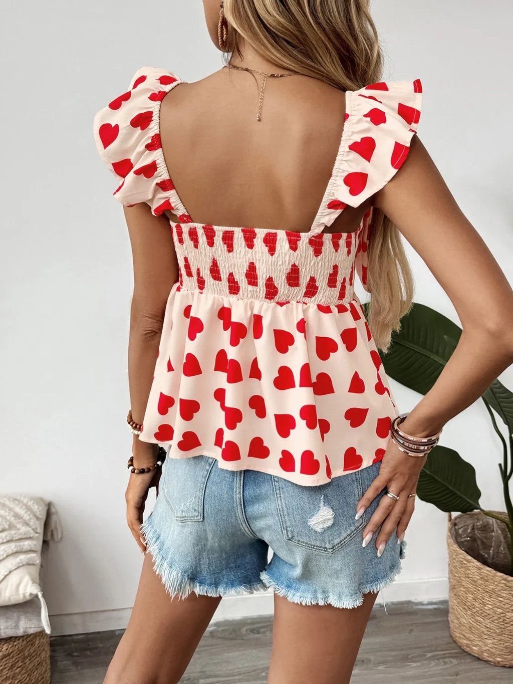 Peplum-Bluse mit Herzprint und Schleife vorne